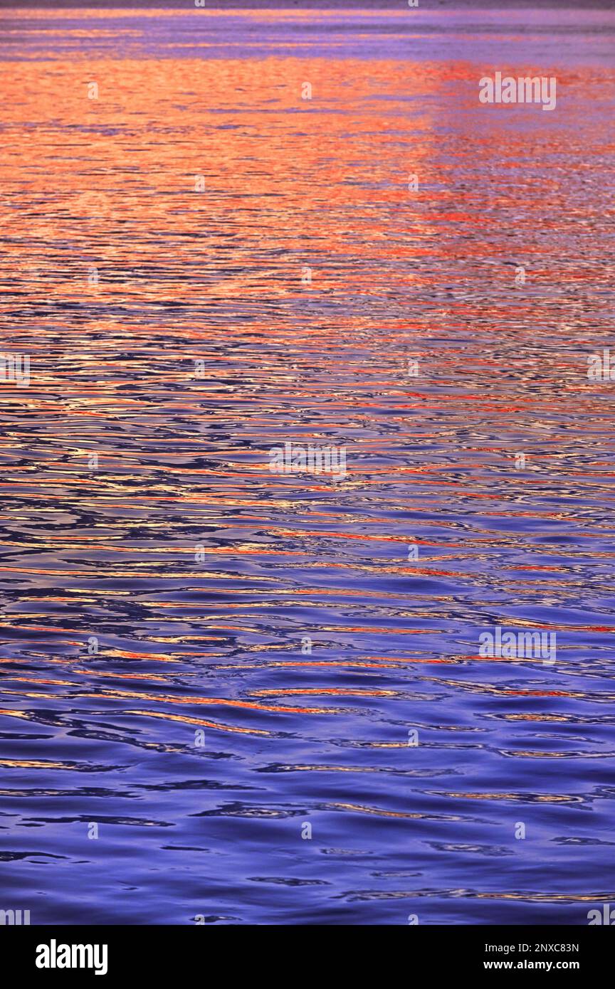 Closeup Colorful Abstract Sunrise Reflection On Danube River in Galati, Romania Stock Photo