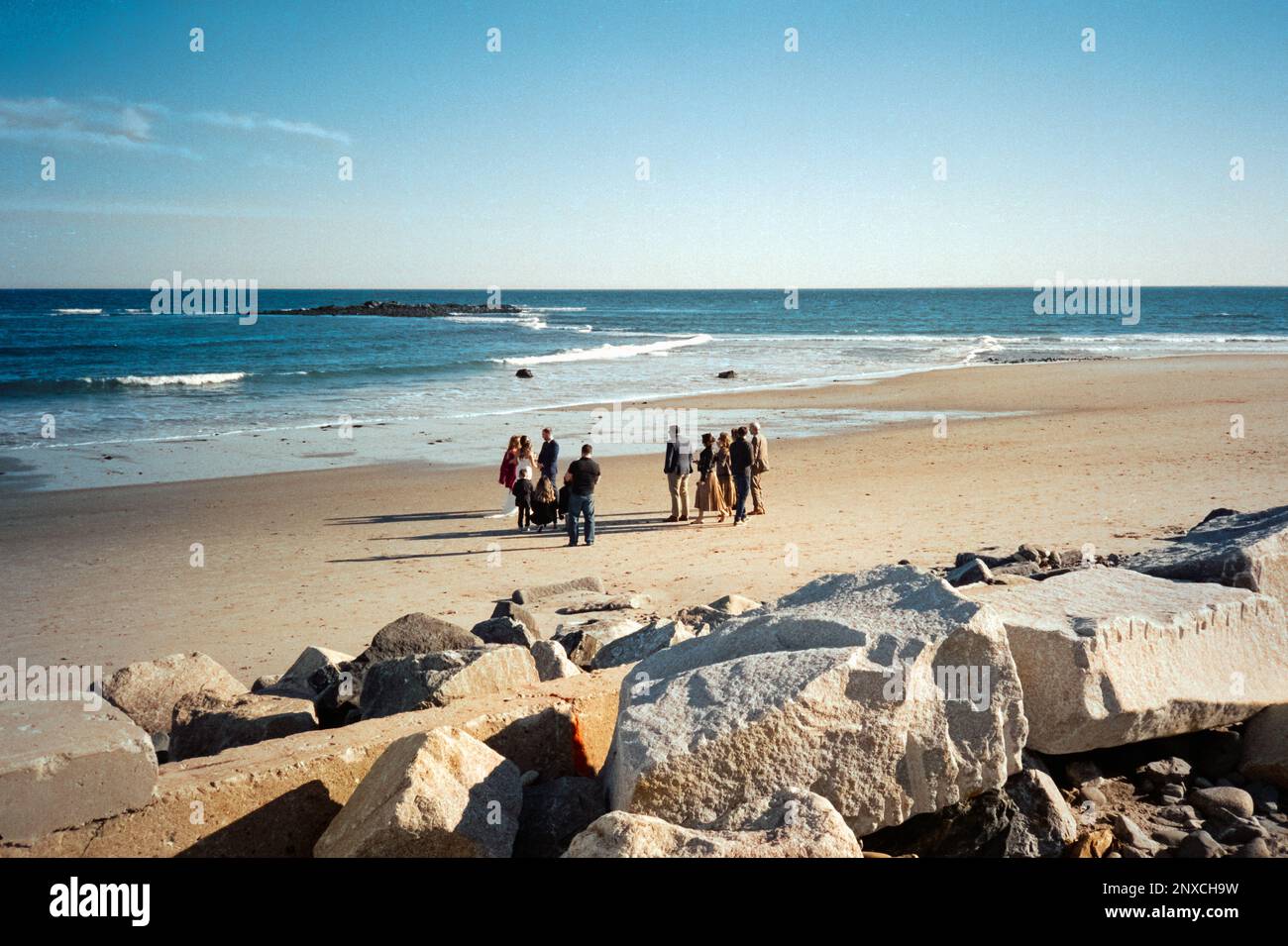 A small autumn wedding on the beach at North Hampton beach, New Hampshire. The image was captured on analog color film. Stock Photo