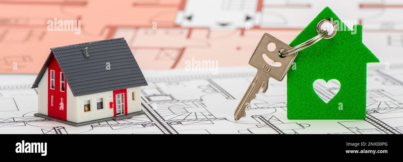 model home and house key with architectural plan Stock Photo