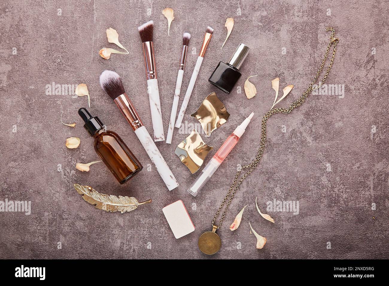 Aesthetic make up set. make up brushes, dropper bottles, cosmetic and jewelry. Feminine flat lay Stock Photo