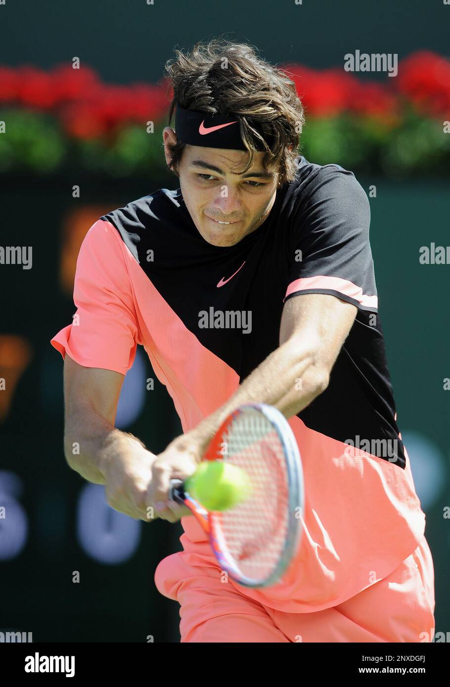 INDIAN WELLS, CA - MARCH 14: ATP tennis player Taylor Fritz (USA) hits a  shot in the second set of a match played during the BNP Paribas Open at the Indian  Wells