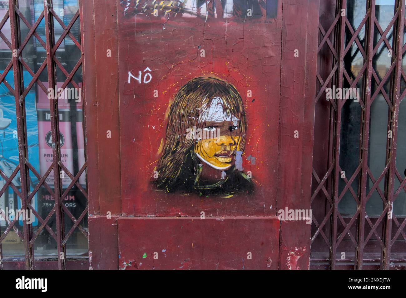 Street art depicting a youngling with face paint, parisian urban art Stock Photo