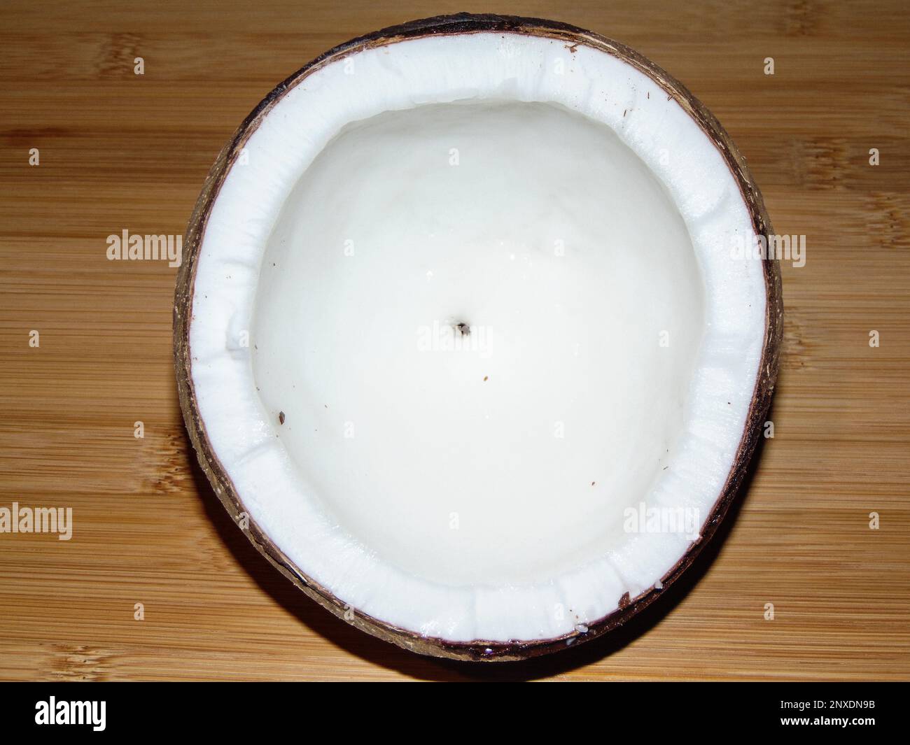 Coconut on a wooden background Stock Photo