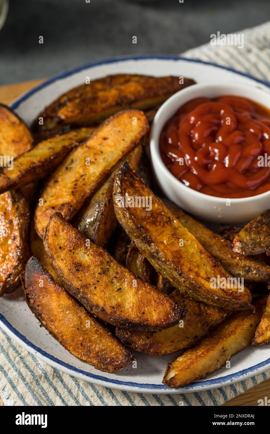 Homemade Cut Potato Wedge French Fries with Ketchup Stock Photo Alamy
