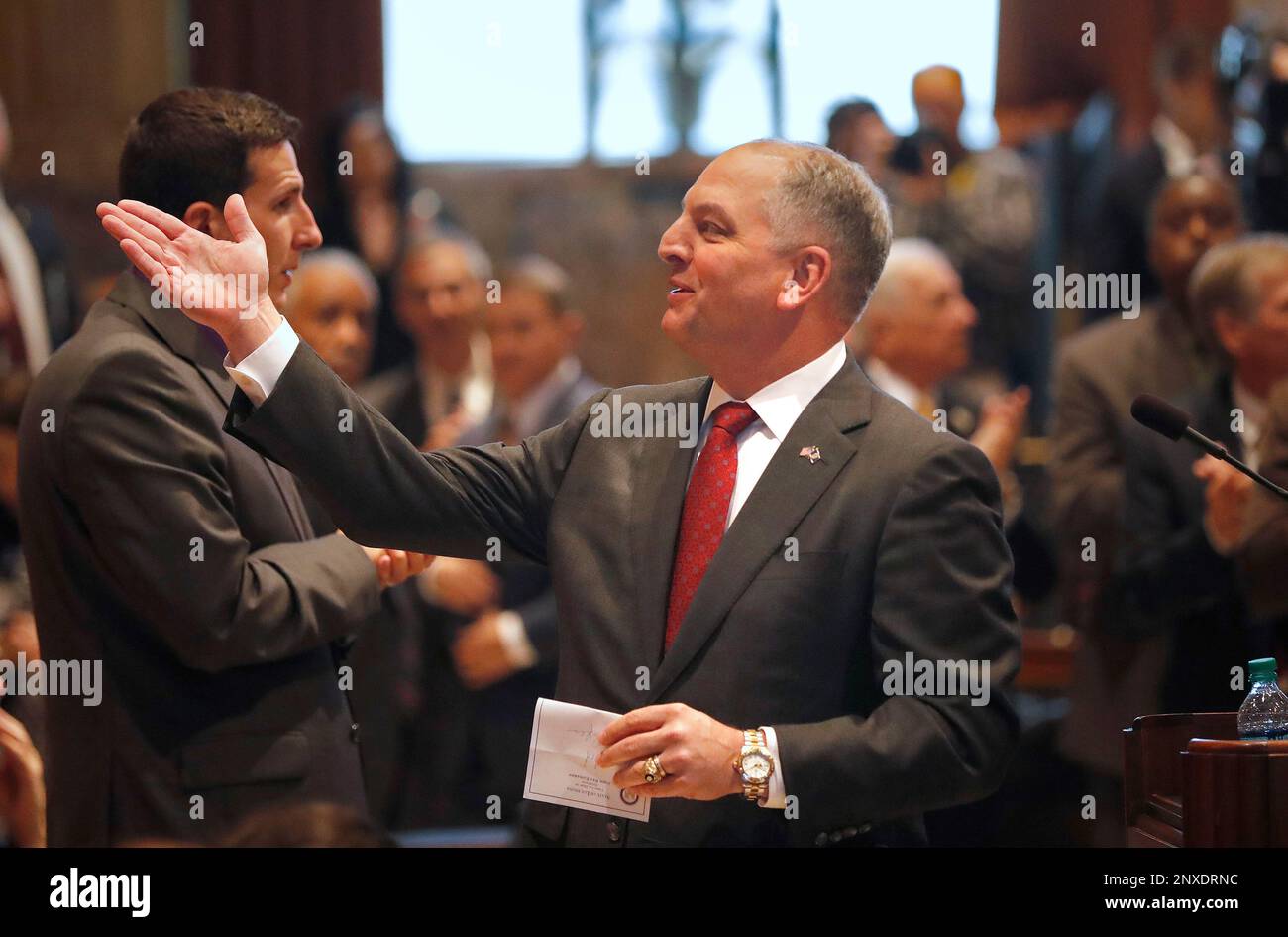 Louisiana Gov. John Bel Edwards gestures to state House Speaker Taylor