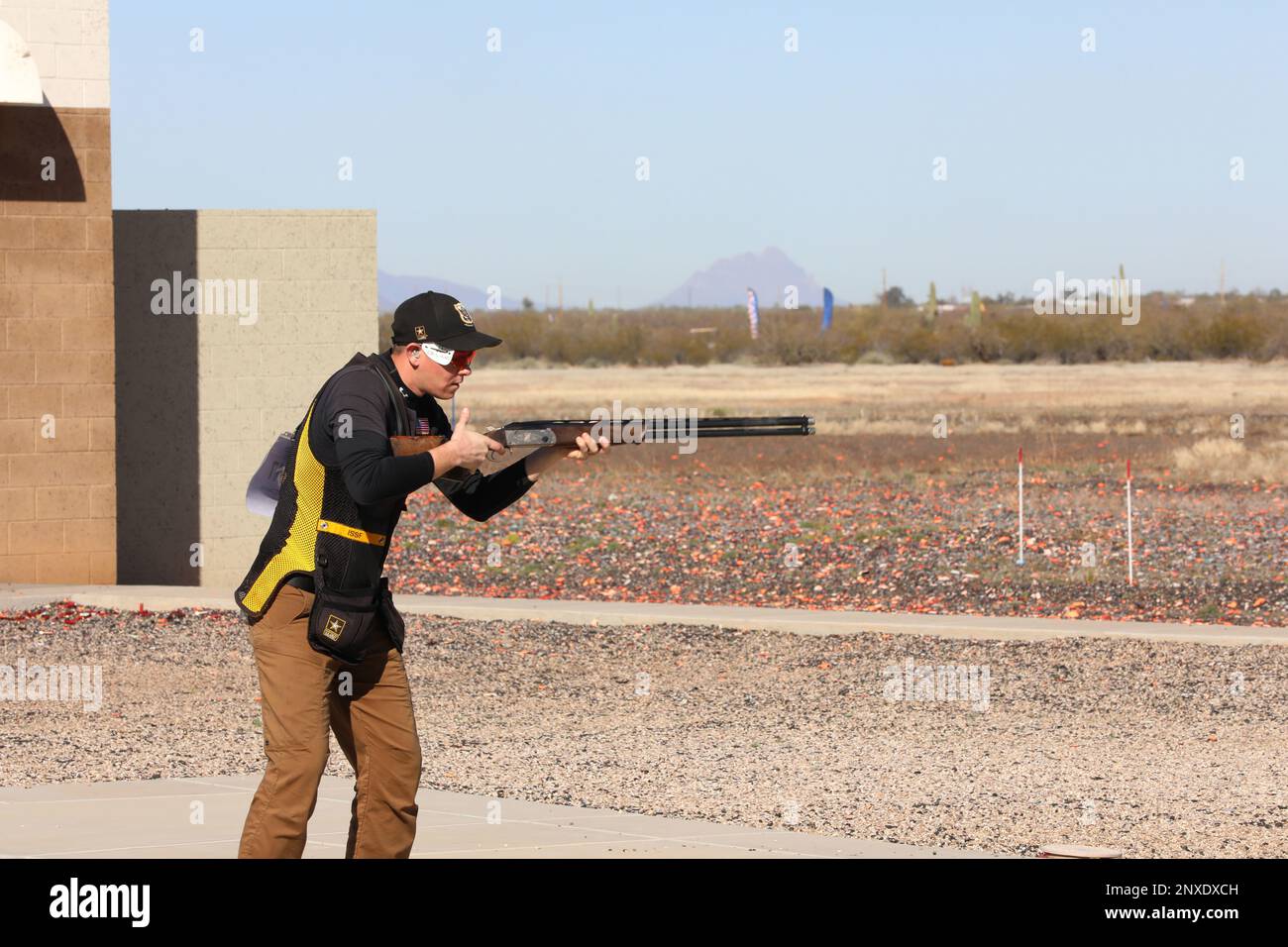 Staff Sgt. Christian Elliot, USAMU Shotgun Team Skeet shooter, inspects his shotgun during the