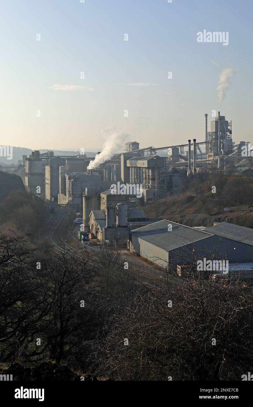 On a cool winter’s morning without much wind the plumes of steam from the Tarmac limestone works at Tunstead are slowly drifting away to the west. Stock Photo