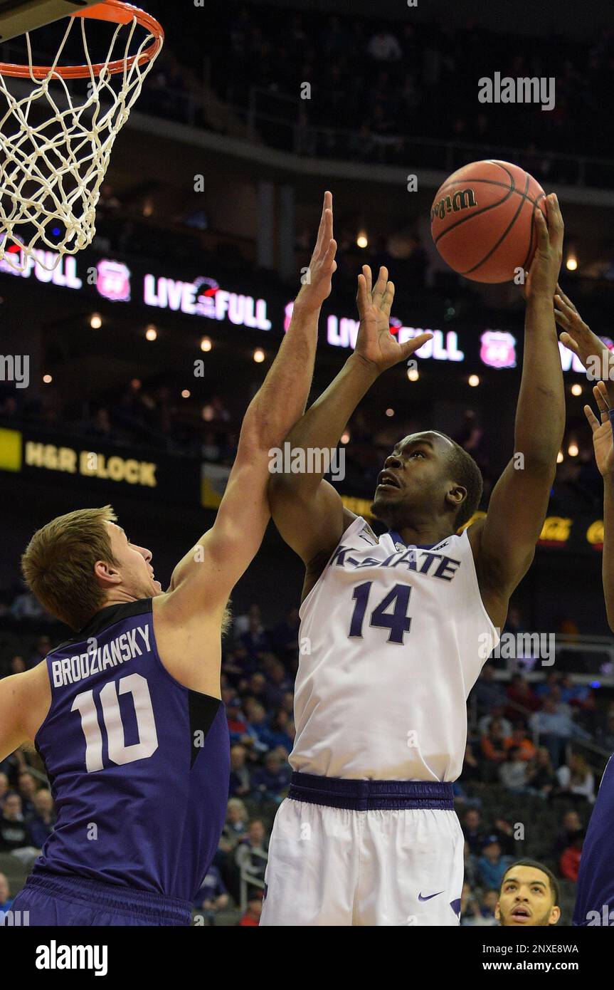 March 08,2018: Kansas State Wildcats forward Makol Mawien (14) shoots a baby  hook in the lane during the 2018 Phillips 66 Big 12 Men's Basketball  Championship Quarterfinal game between the Kansas Jayhawks