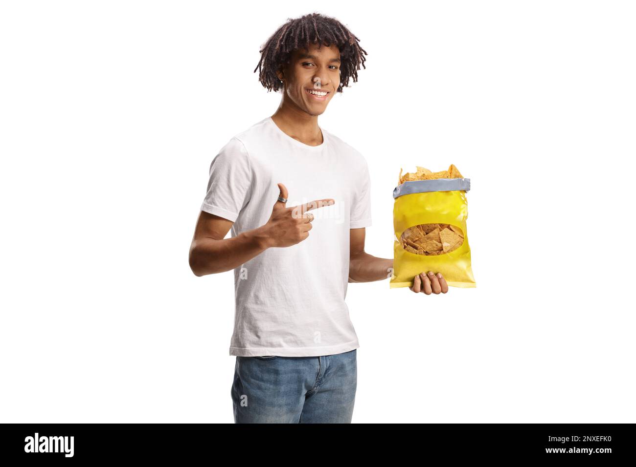 Young african american man pointing at a pack of tortilla crisps and smiling isolated on white background Stock Photo