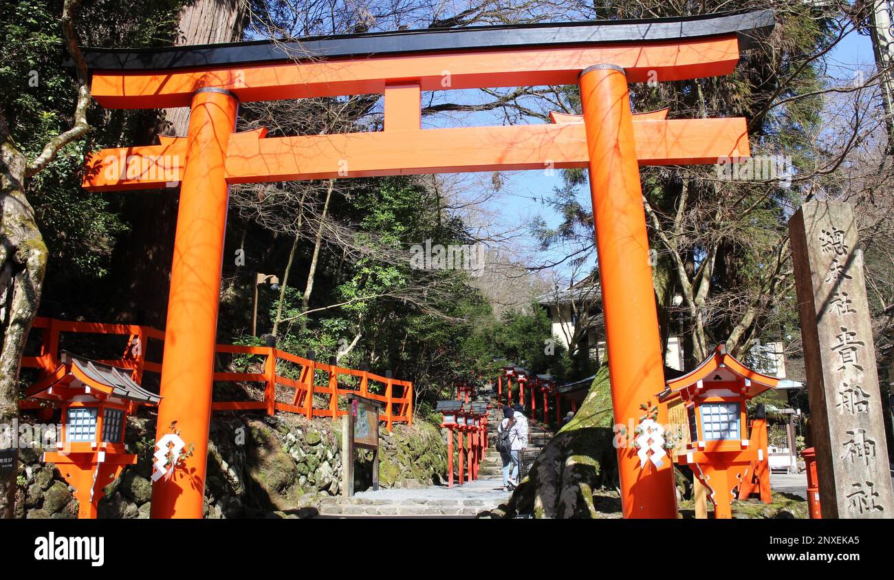 Torii of Kifune shrine in Kyoto, Japan (with a stone monument meaning
