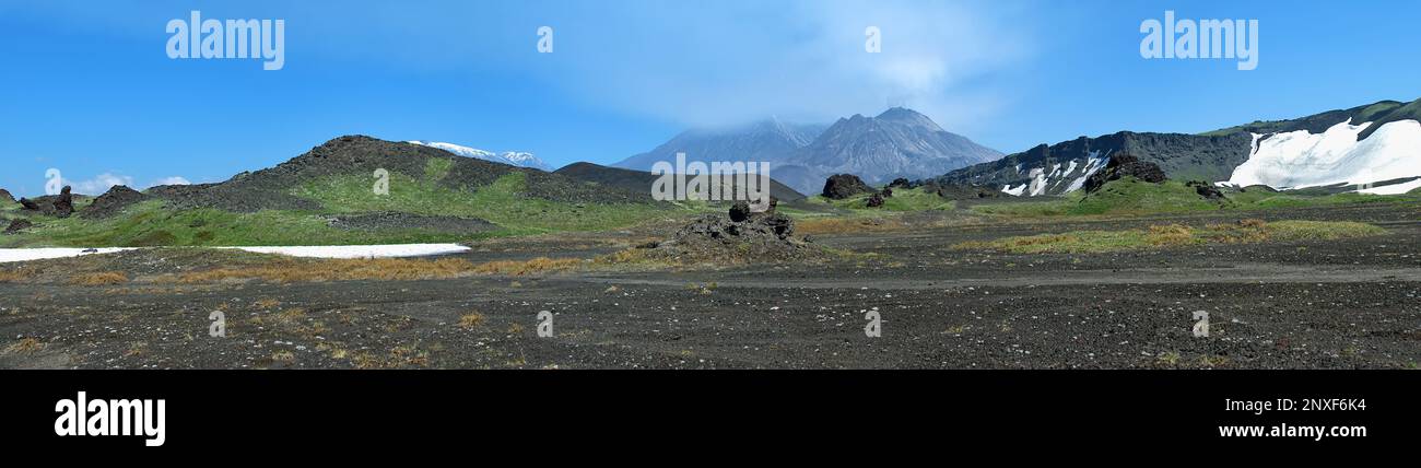 Cinder road, auto travel through volcanic plateau on eruptions of scoria (slag fields). Volcanic cones through fault region of Earth's crust (volcanic Stock Photo