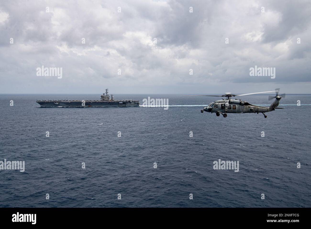 230215-N-ZQ263-1297 SOUTH CHINA SEA (Feb. 15, 2023) An MH-60S Sea Hawk