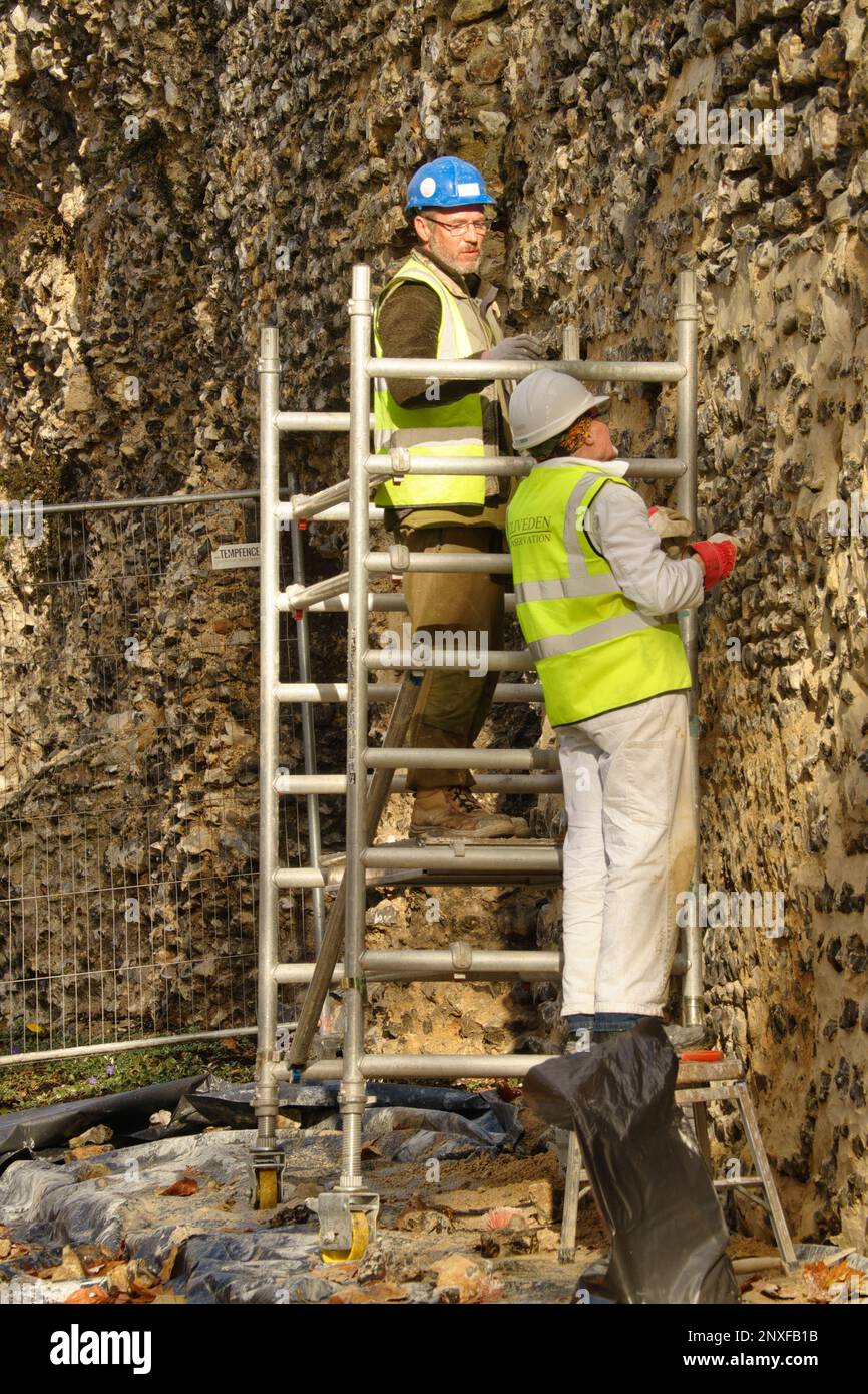 Men Carrying Out Repairs To The Abbey, Reading Berkshire UK Stock Photo