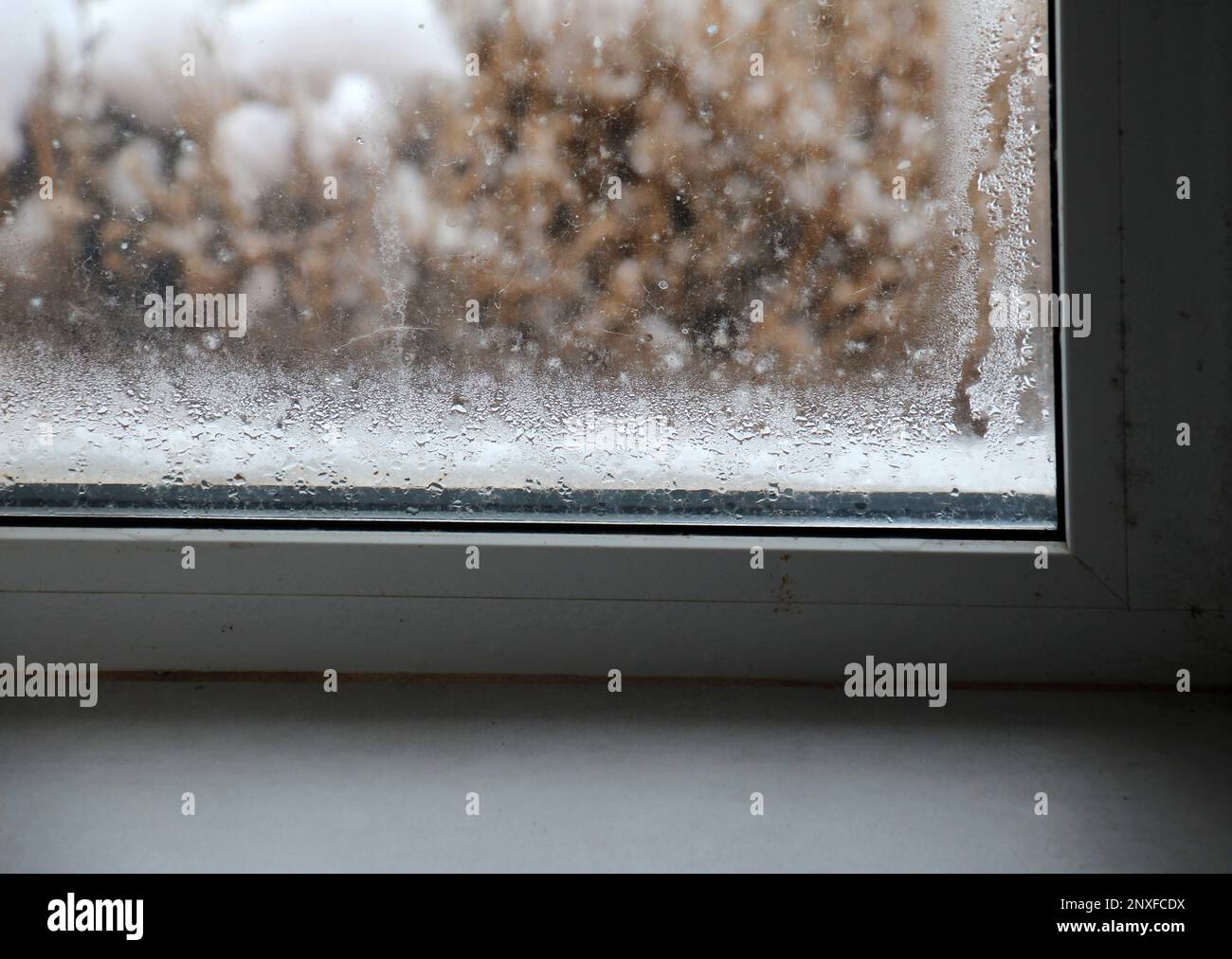 Fogging of metal plastic windows due to cooling and high humidity Stock Photo