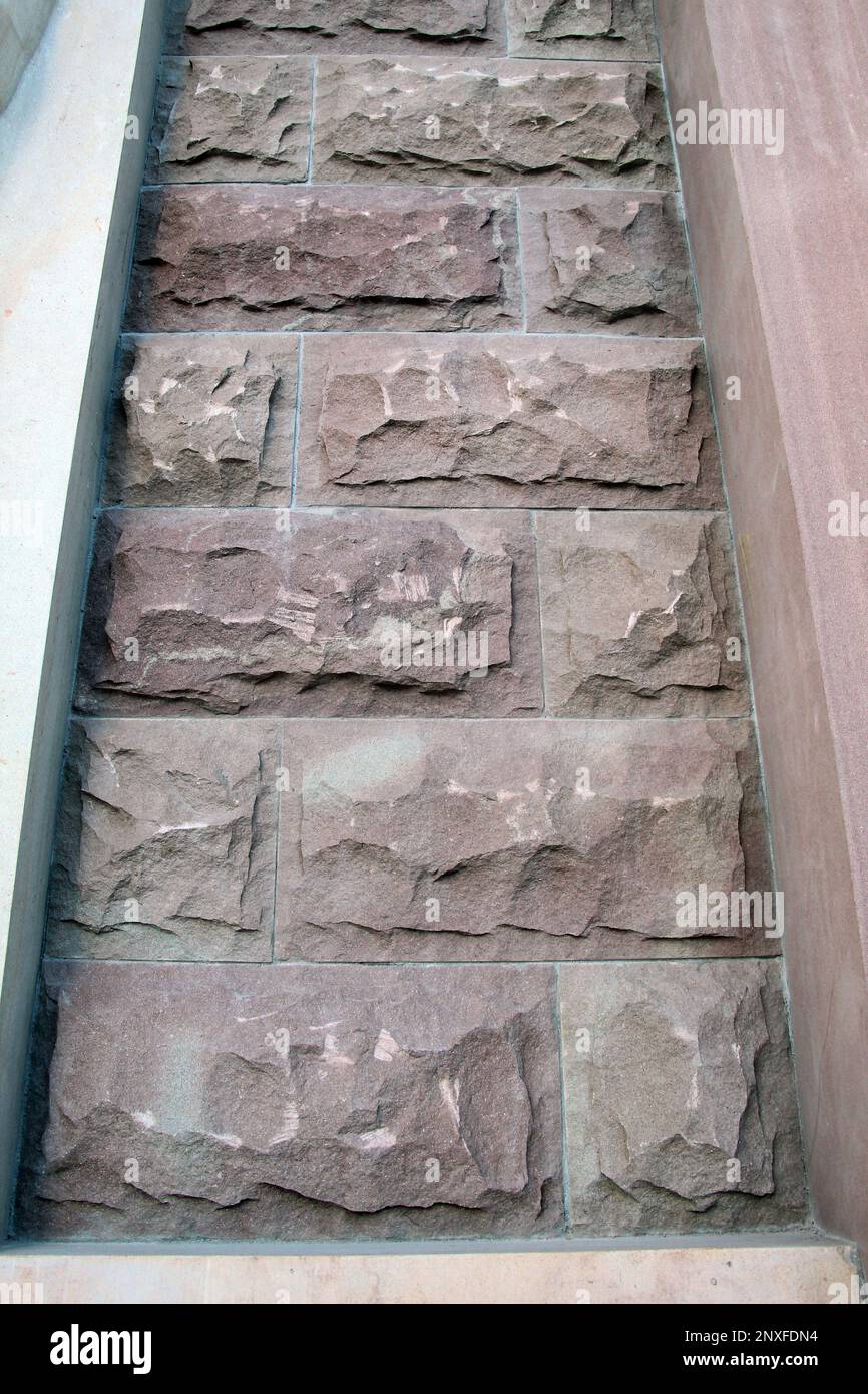 Split and processed red natural stone is used in construction Stock