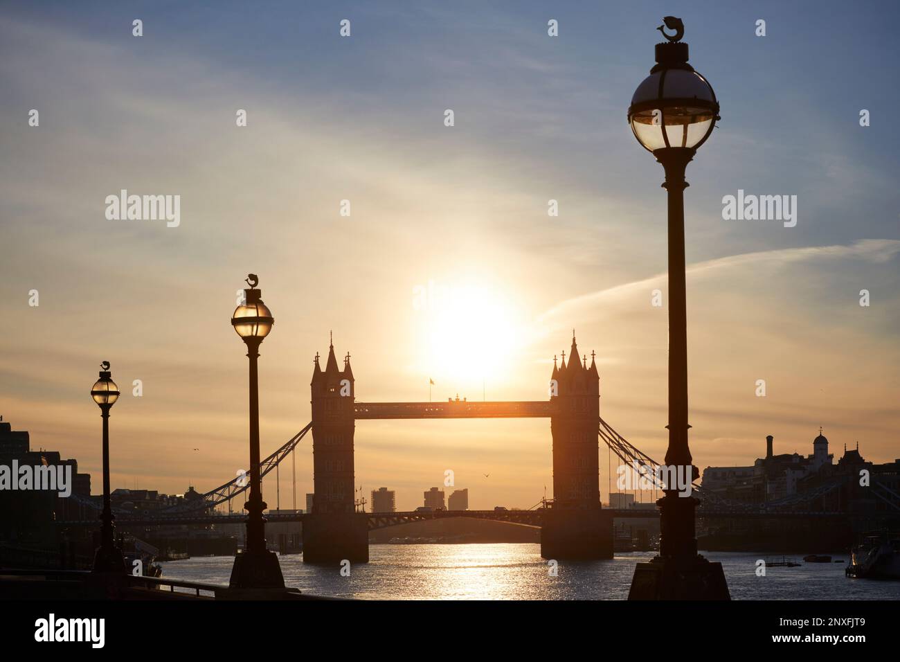 Street lamps and Tower Bridge silhouetted, London, England, GB Stock Photo