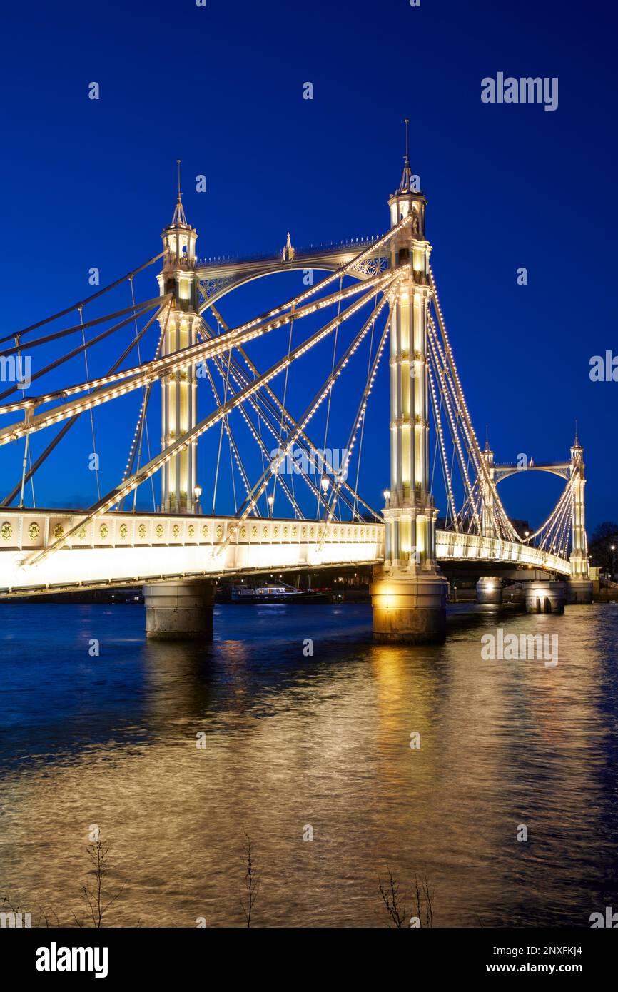 Albert Bridge illuminated at dusk, London, England, GB Stock Photo