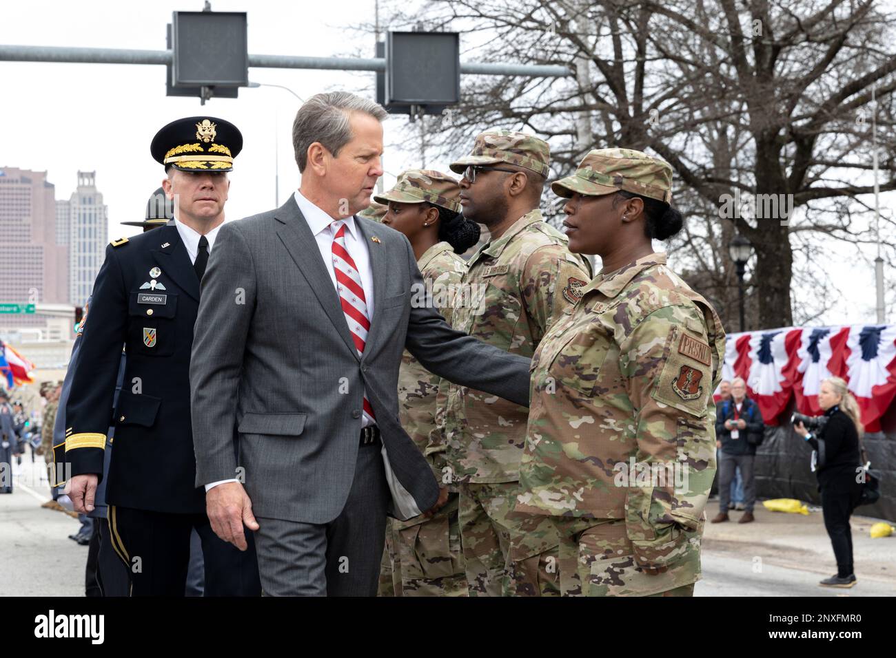 Governor Brian Kemp, U.S. Army Maj. Gen. Tom Carden, The Adjutant General of Georgia, and Col. Chris Wright, Georgia Department of Public Safety Commissioner, review a formation of Soldiers, Airmen, Georgia State Patrol Officers, and Georgia State Defense Force Volunteers Jan. 12, 2023 at the Georgia State Convocation Center near Atlanta, Georgia. Stock Photo