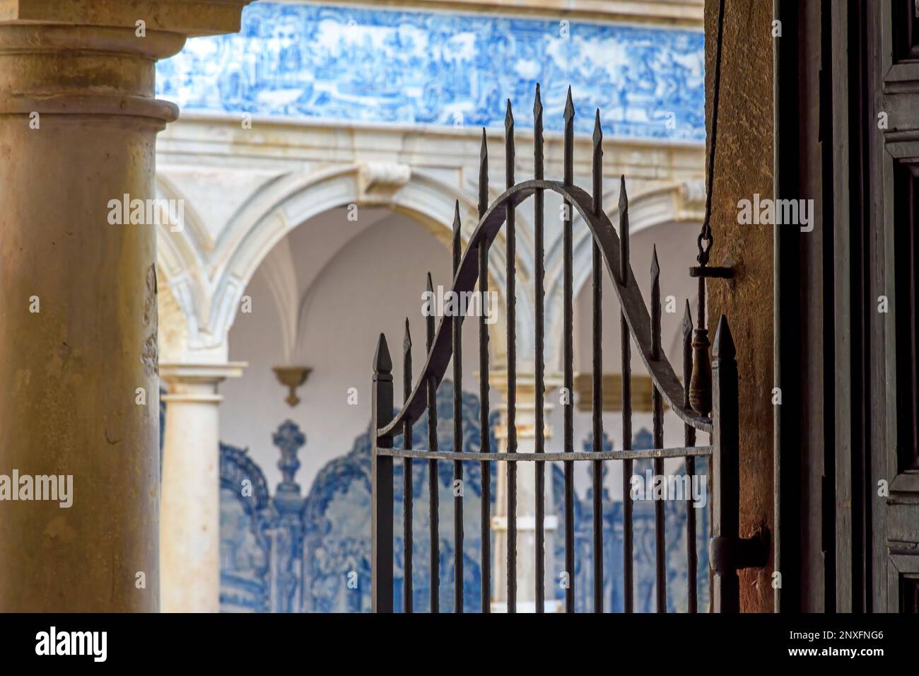 Arches and gate in the inner courtyard of an old historic convent in ...