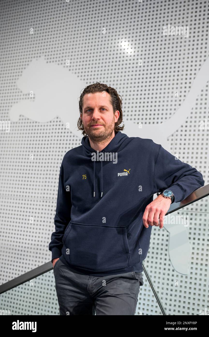 Herzogenaurach, Germany. 01st Mar, 2023. Portrait of Arne Freundt, CEO at  Puma, with Puma logo in the background. The eternal competition between the  sporting goods manufacturers in the Franconian province has a