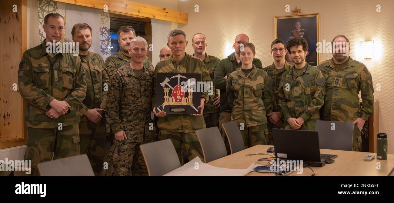 U.S. Marines with 2d Combat Engineer Battalion, 2d Marine Division pose for a photo with Norwegian Army Soldiers with Norwegian Army Logistics Element-Allied Training Center as part of Marine Rotational Forces Europe 23.1 in Setermoen, Norway Jan. 27, 2023. MRF-E focuses on regional engagements throughout Europe by conducting various exercises, mountain-warfare training, and military-to- military engagements which enhance overall interoperability of the U.S. Marine Corps with allies and partners. Stock Photo