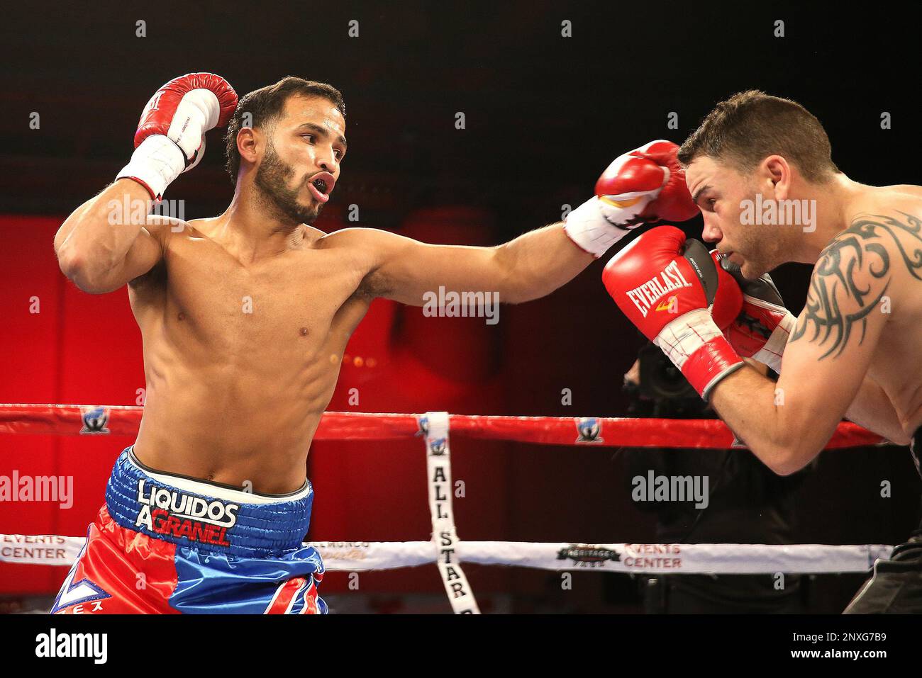 Jose Lopez (L) fights Daniel Lopez during a Telemundo boxing match ...