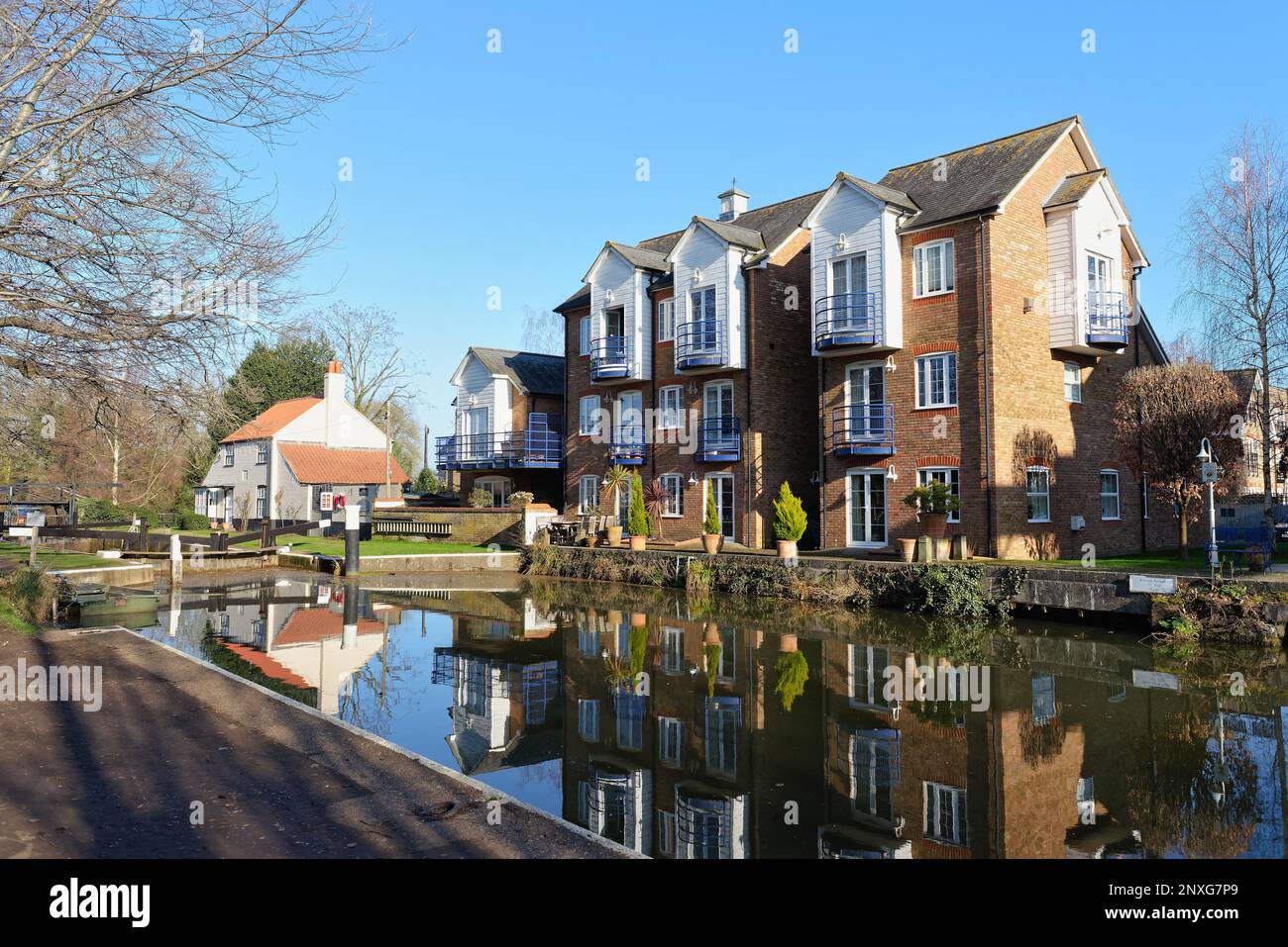 Modern waterside apartments developed from old industrial buildings on the River Wey canal