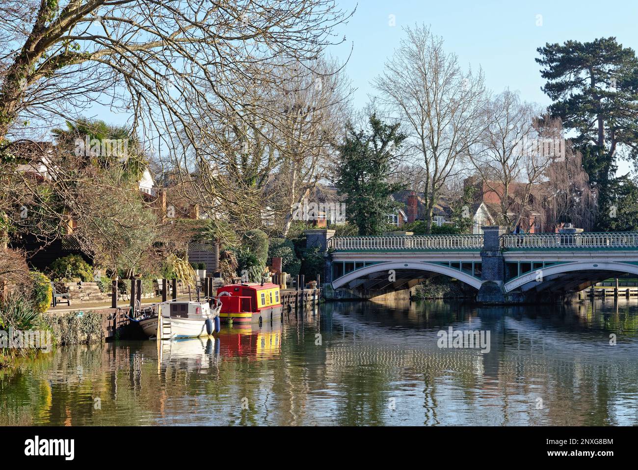 Private houses and gardens by the River Wey canal navigation at