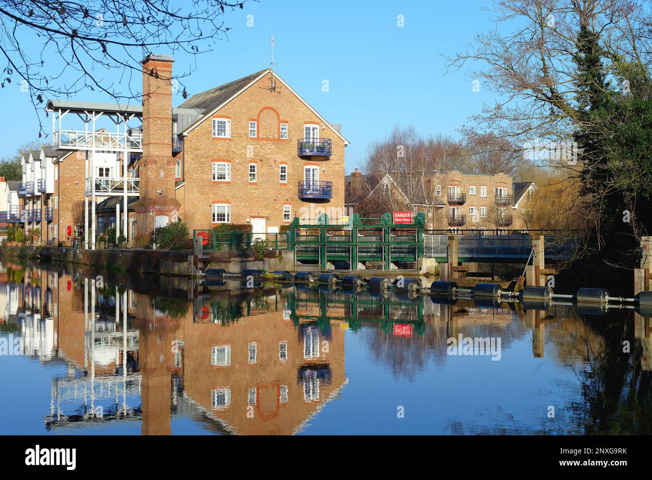 Modern waterside apartments developed from old industrial buildings on the River Wey canal