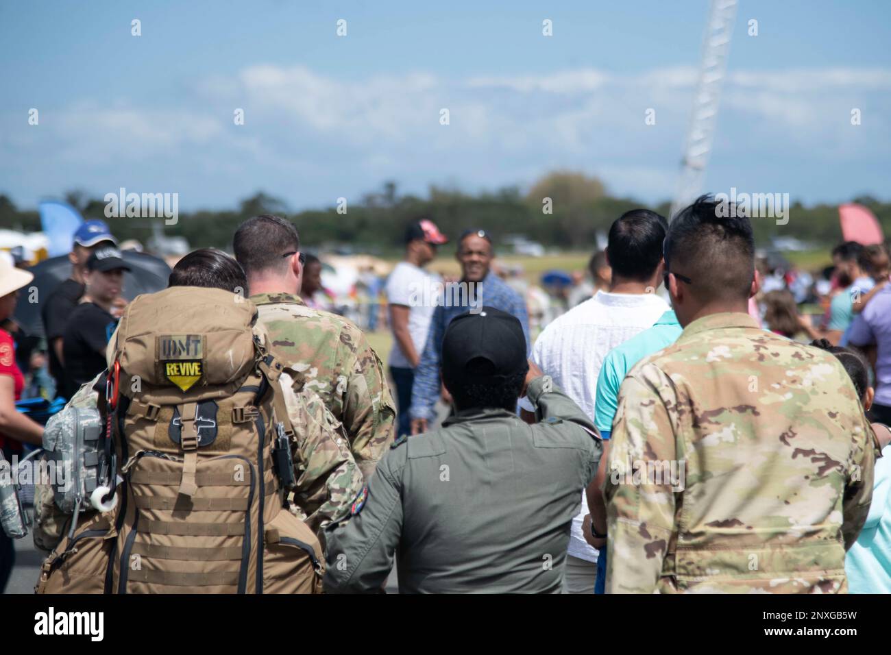 U.S. Air Force first responders walk alongside a Fuerza Aérea de la ...