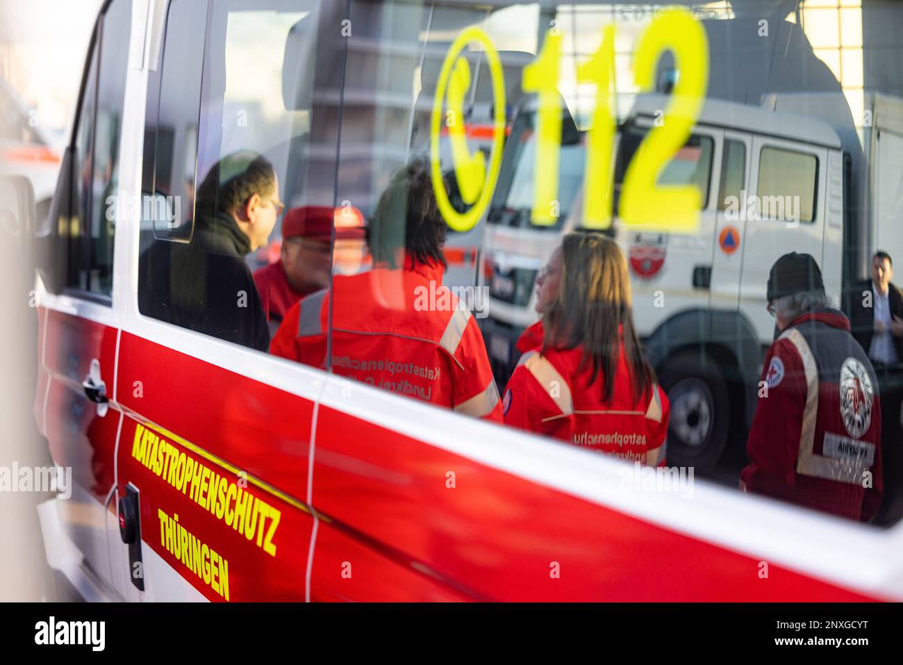Gotha, Germany. 01st Mar, 2023. Disaster relief workers watch the