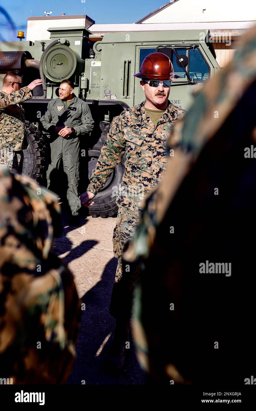 U.S. Marine Corps Staff Sgt. Michael Vogels, an engineer equipment operator with Marine Aircraft Group 41 (MAG-41), conducts a tour at Naval Air Station Joint Reserve Base Fort Worth, Texas, Jan. 12, 2023. MAG-41 operates from 8 sites in 6 states and is assigned 75 rotary-wing, fixed-wing, and tilt-rotor aircraft. Over 3,000 Marines and Sailors assigned to 9 squadrons provide combat forces in overseas contingency operations, theater security cooperation missions, unit deployment program, training exercises, and daily tasking to provide operational support to the active component. Stock Photo