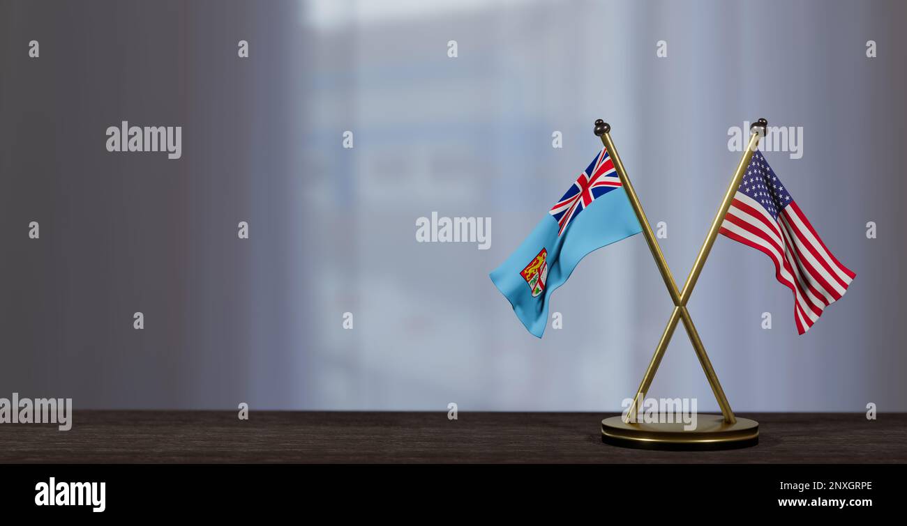 Fiji and USA flags on table. Negotiation between Fiji and United States. on little blur background. 3D work and 3D image Stock Photo