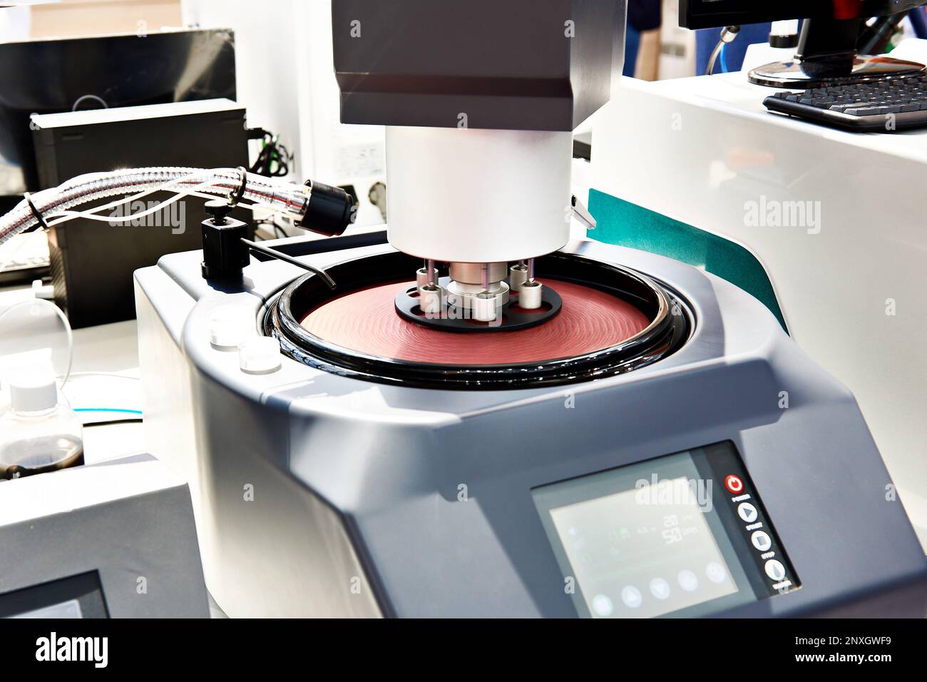 Automatic grinding and polishing machine in lab Stock Photo Alamy