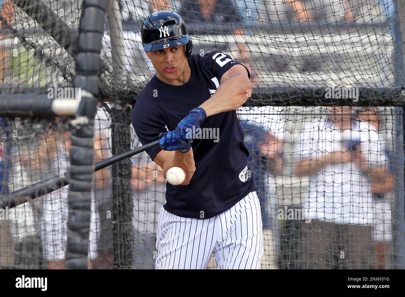 TAMPA, FL - MARCH 16: New York Yankees DH Giancarlo Stanton (27) at bat  during the Yankees spring training workout on March 16, 2022, at  Steinbrenner Field in Tampa, FL. (Photo by