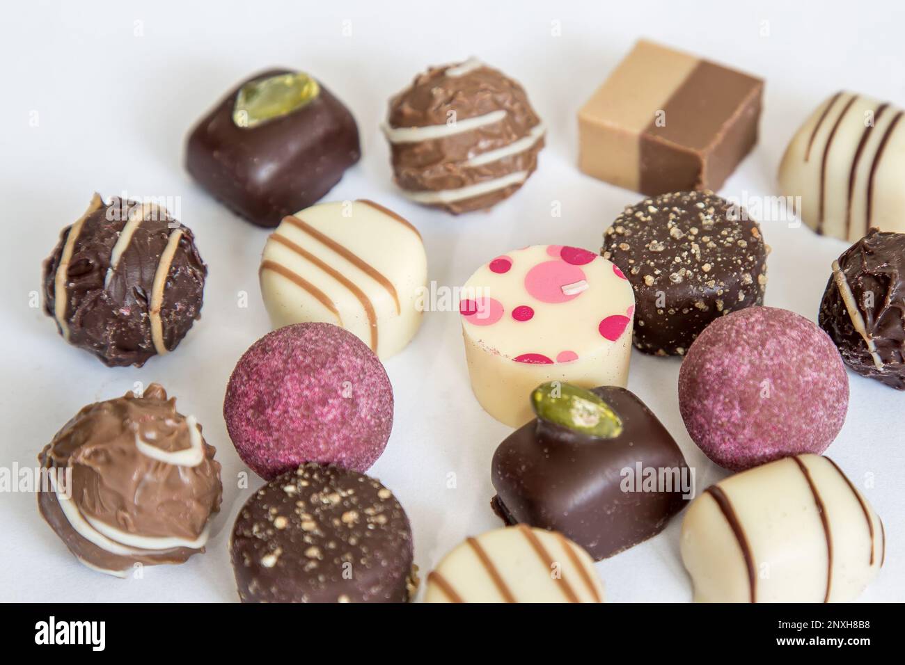 Assortment sweet confectionery of chocolate, candies and pralines. Stock Photo