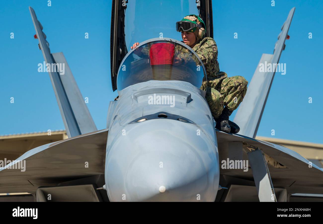 U.S. Navy AME3 Ariana Scott places a cover over the headup guidance