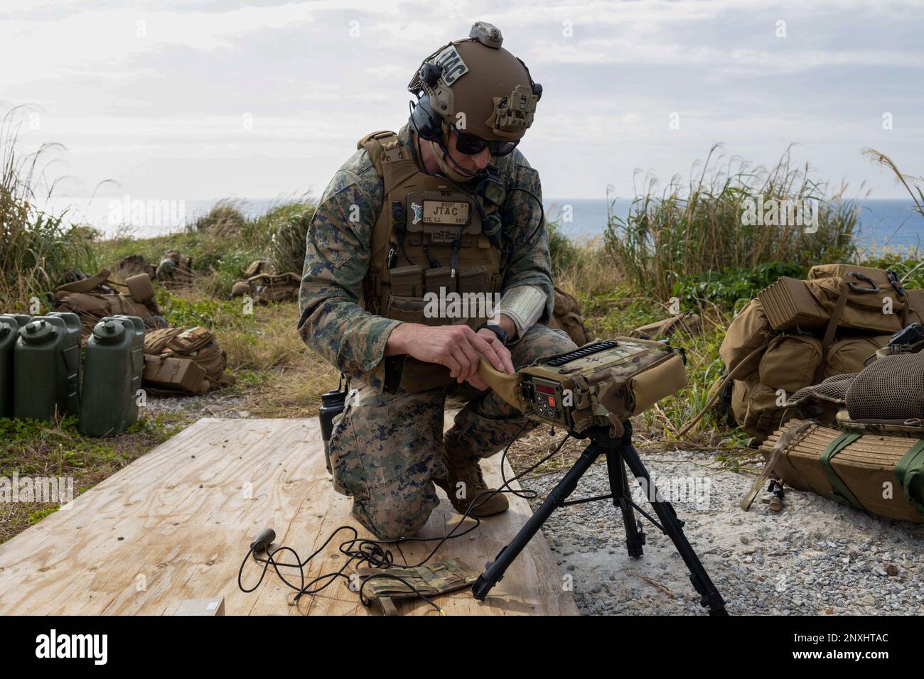 U.S. Marine Corps Gunnery Sgt. Thomas Dye, the battalion fires chief for 3rd Reconnaissance Battalion, sets up a Type 163 laser target designator during a tactical air control party at W-174 Live Fire Range, Okinawa, Japan, Jan. 10, 2023. The training provided an opportunity to work in a dynamic tactical situation and refine target plotting skills. The 31st MEU, the Marine Corps’s only continuously forward- deployed MEU, provides a flexible and lethal force ready to perform a wide range of military operations as the premiere crisis response force in the Indo-Pacific region. Stock Photo