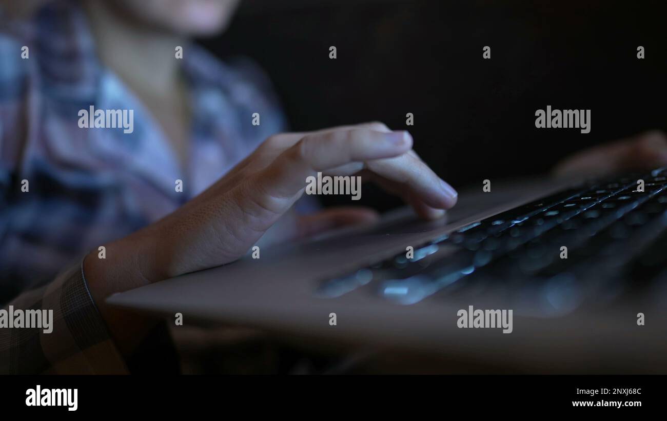 Computer Bowsing Closeup woman brosing internet on laptop at home using trackpad. Person ...