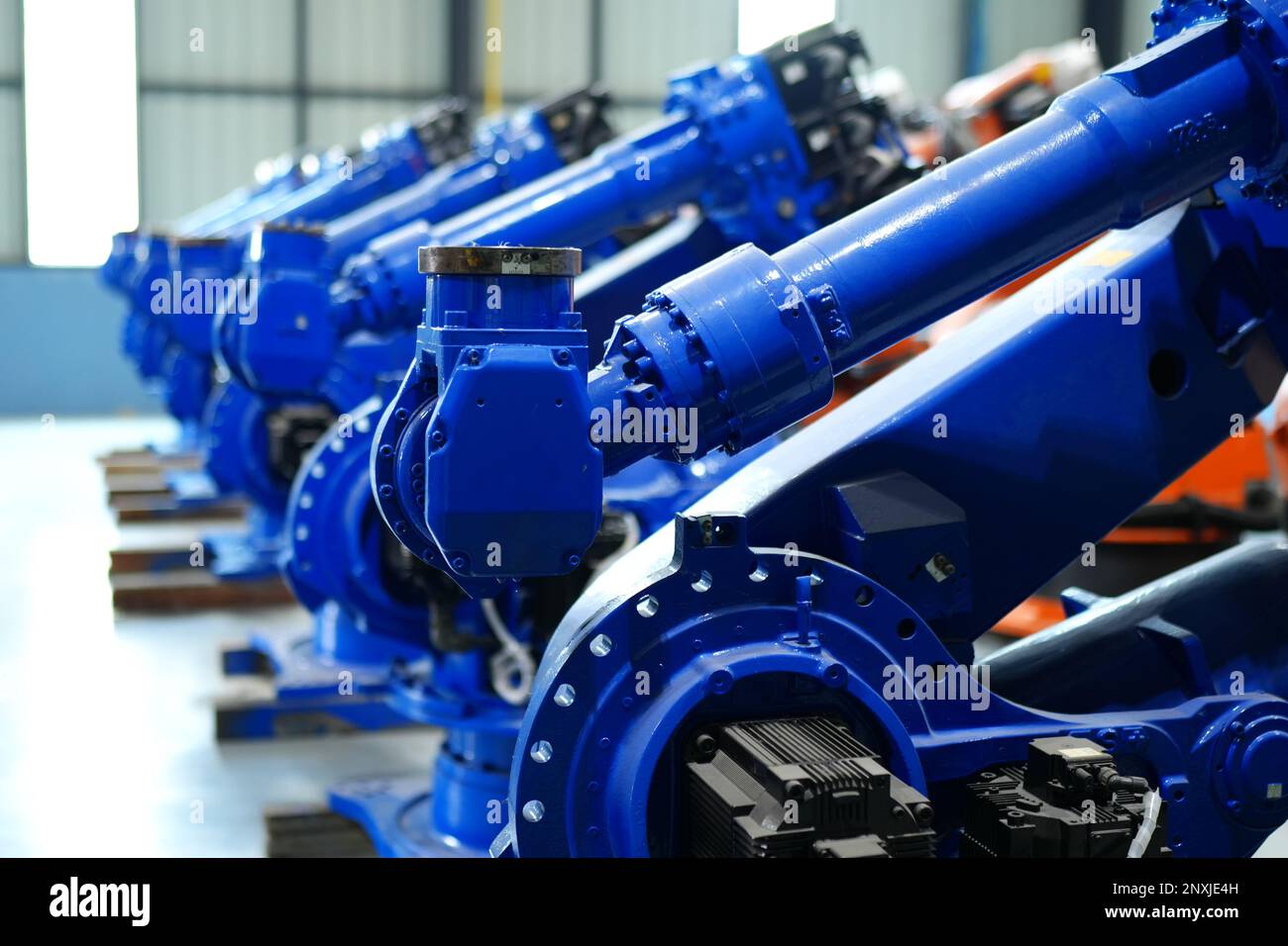 Robotic arm in futuristic assembly manufacturing factory, in factory ...
