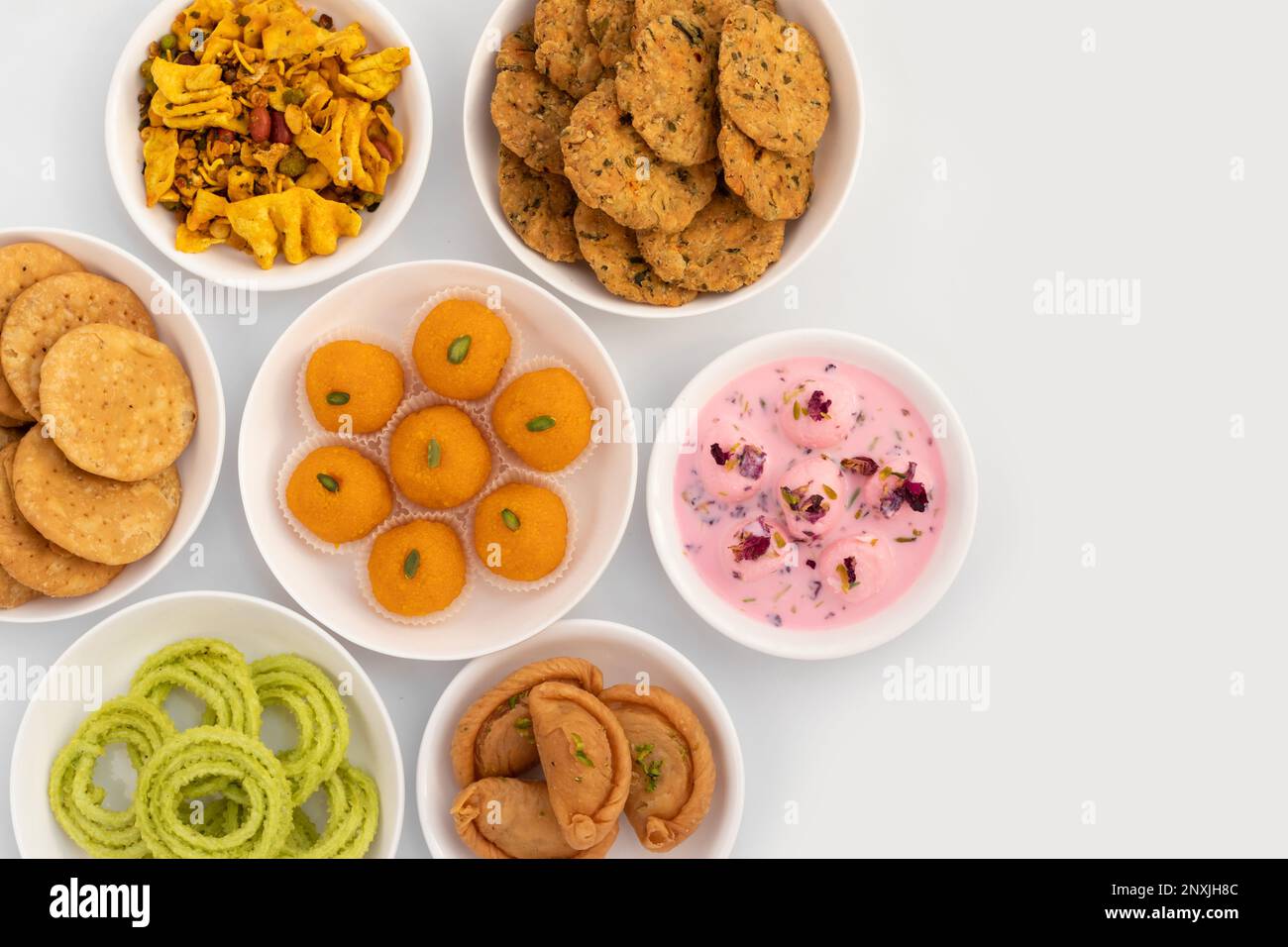 Assorted Indian Festive Spicy Salted And Sweet Snacks - Gujiya, Murukku ...