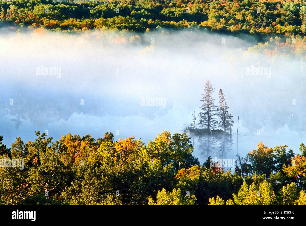 Early morning fog hovers over a lake in Itaska State Park in northern Minnesota. Stock Photo