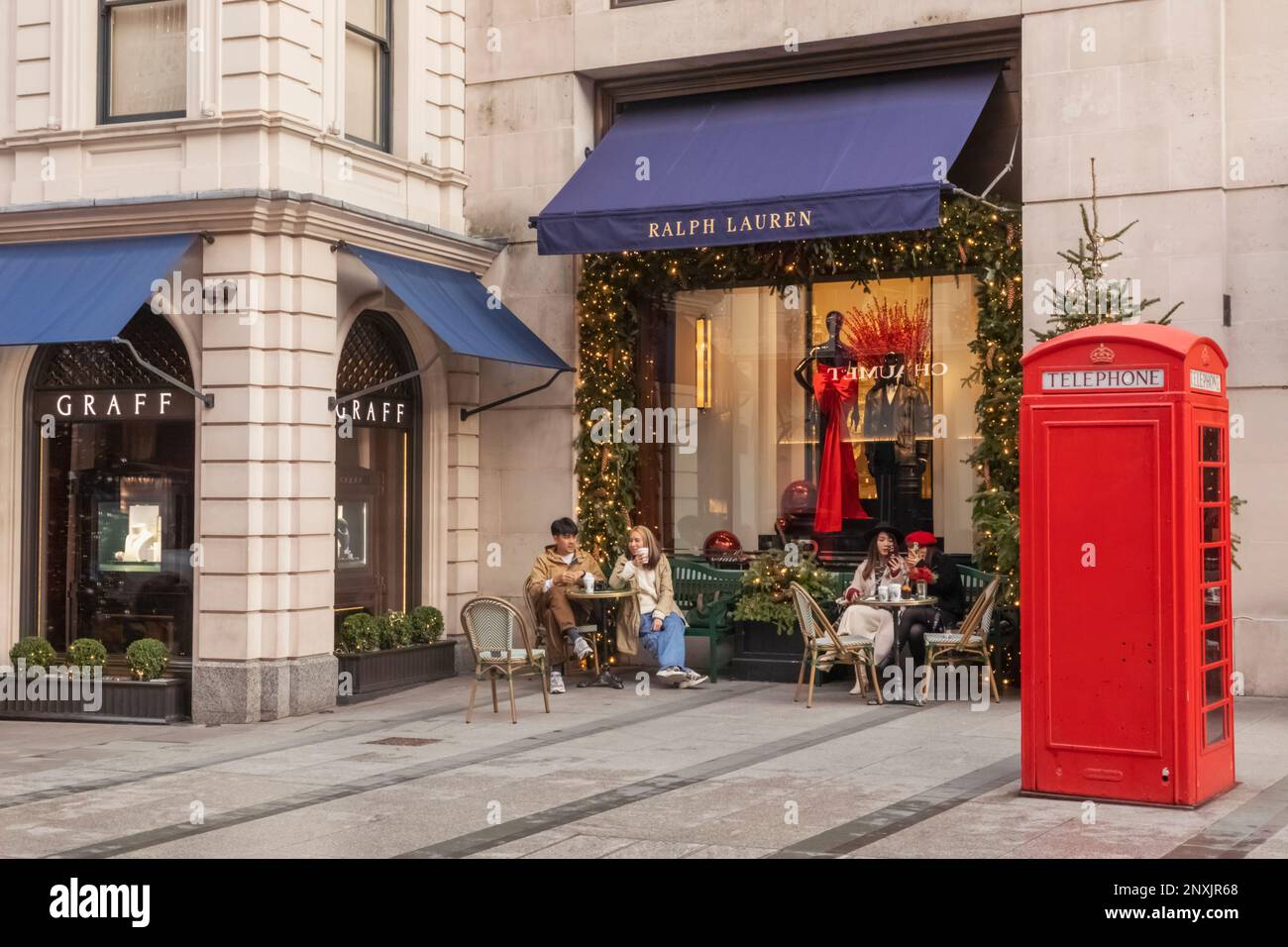 England, London, Piccadilly, New Bond Street, Exterior View of Ralph Lauren Store with Christmas Decorations and Traditional Red Telephone Box Stock Photo