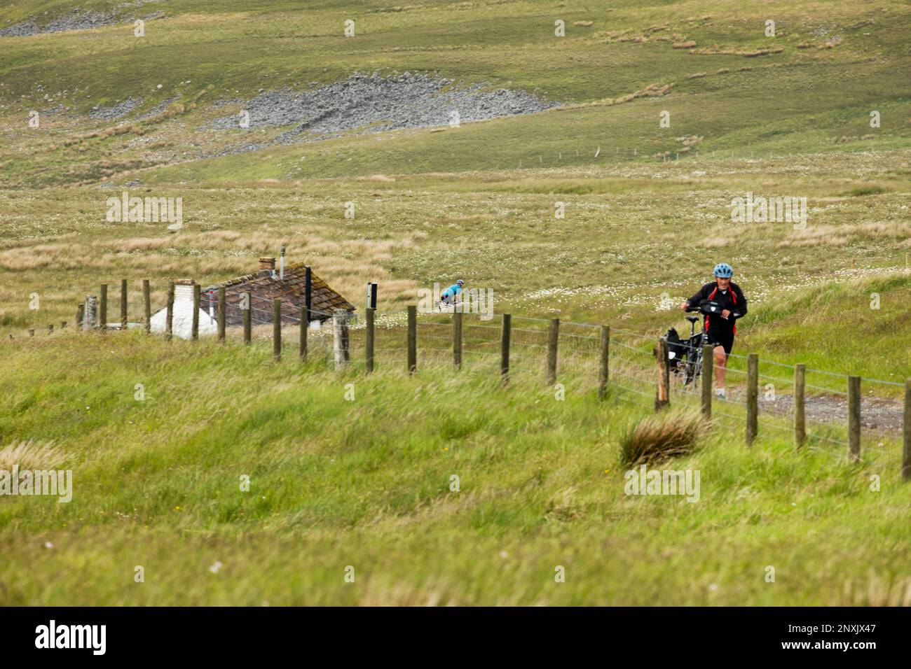Sea to Sea Cyclists approaching Hartside Pass Summit, near Alston,North Pennines, Cumbria Stock Photo