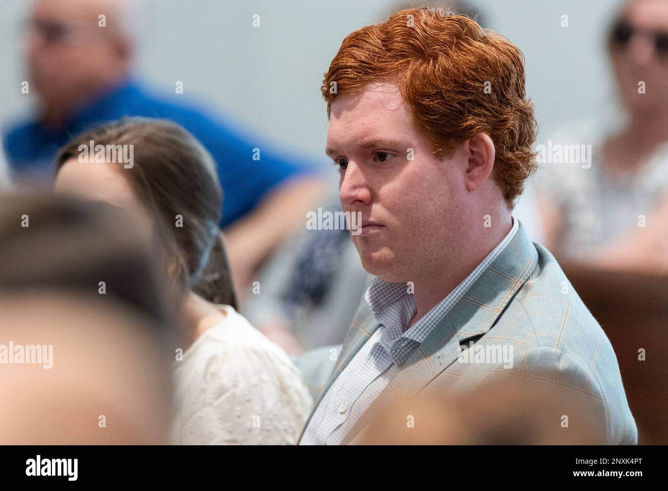 Buster Murdaugh, the son of Alex Murdaugh, listens as prosecutor Creighton Waters describes his