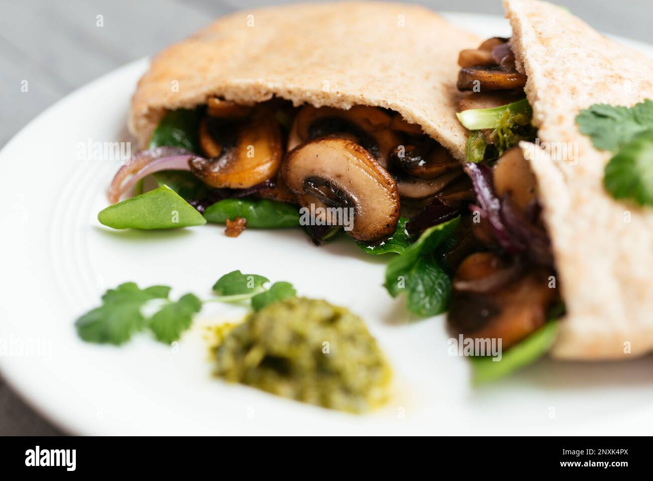 Pita breads filled with sauteed mushrooms and onions with winter