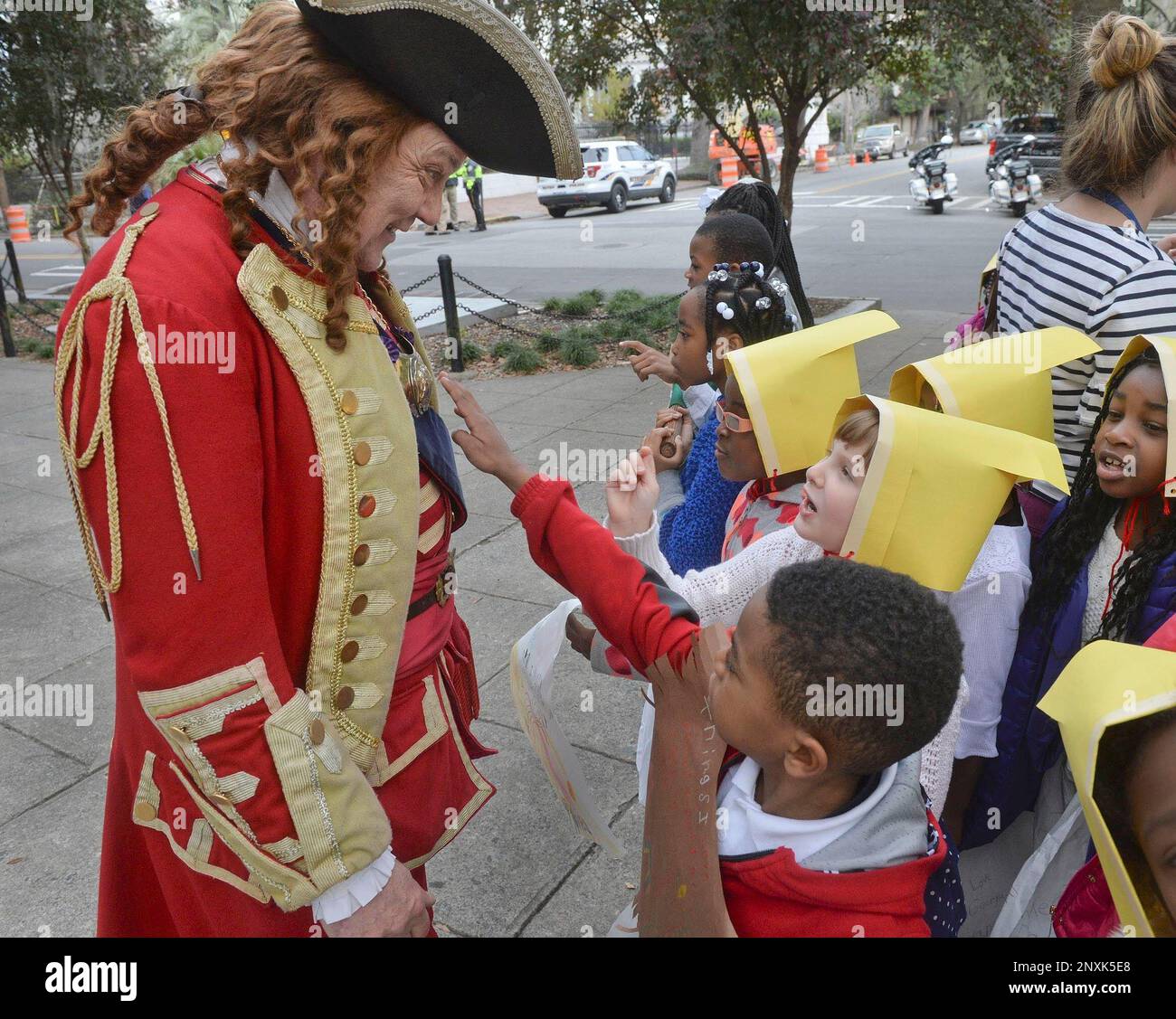 Scott Hodges, portraying Gen. Oglethorpe, shows his uniform to students