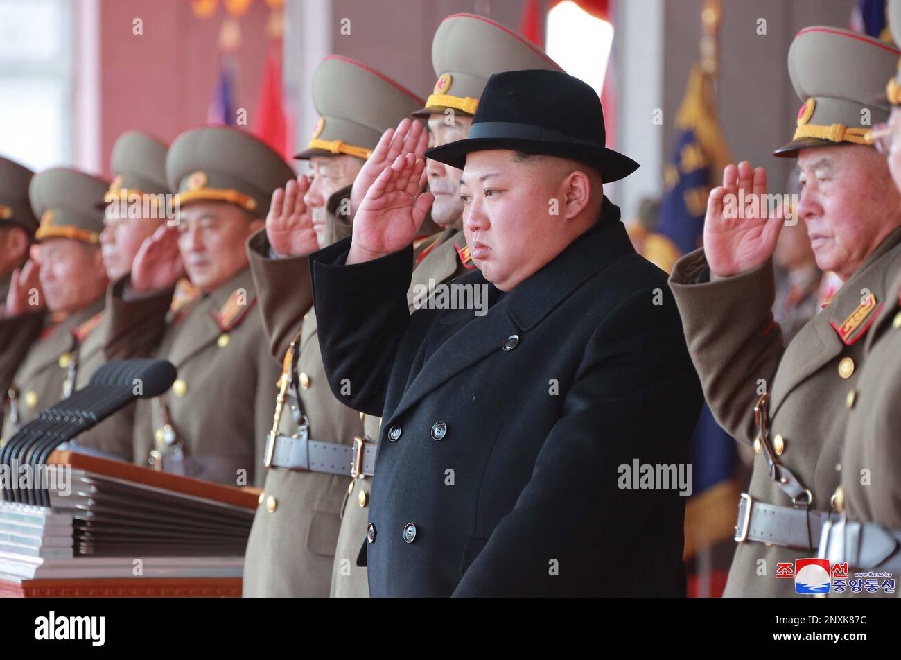 In this Thursday, Feb. 8, 2018, photo provided by the North Korean  government, North Korean leader Kim Jong Un, second right, attends a  military parade to mark the 70th anniversary of the