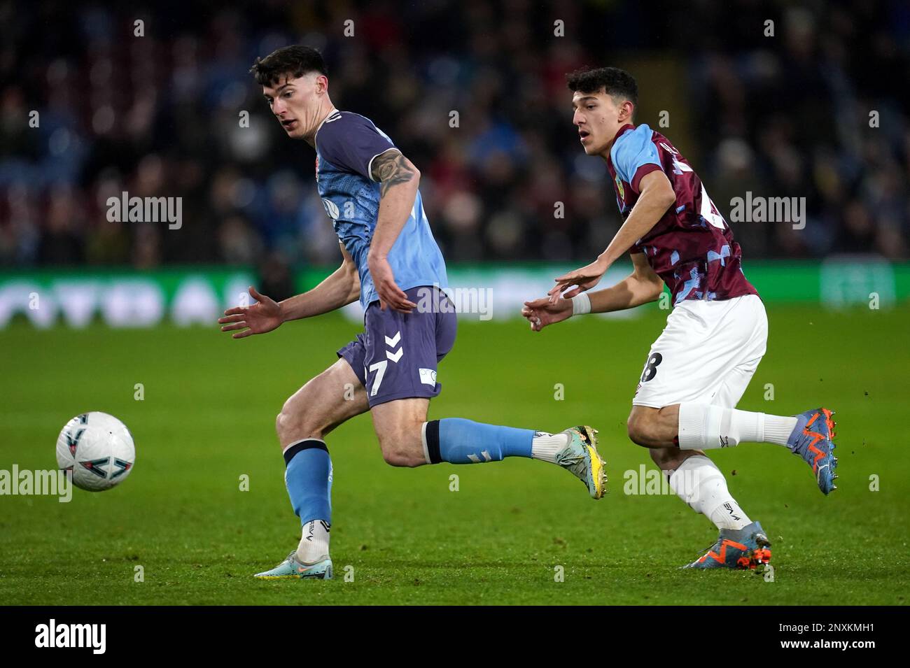 Fleetwood Town's Harvey Macadam (left) and Burnley's Ameen Al-Dakhil in action during the Emirates FA Cup fifth round match at Turf Moor, Burnley. Picture date: Wednesday March 1, 2023. Stock Photo