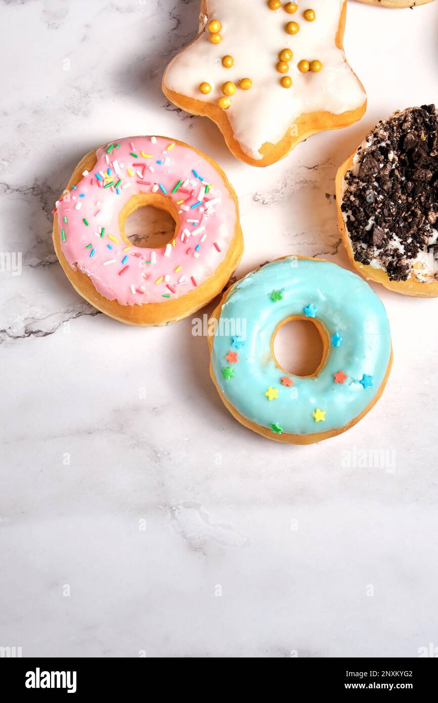 several different donuts on a white background Stock Photo - Alamy